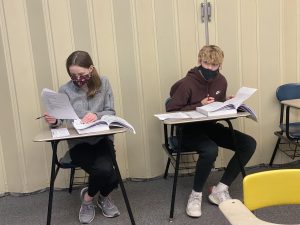 Carter Anderson and Claudia Jacobson in class
